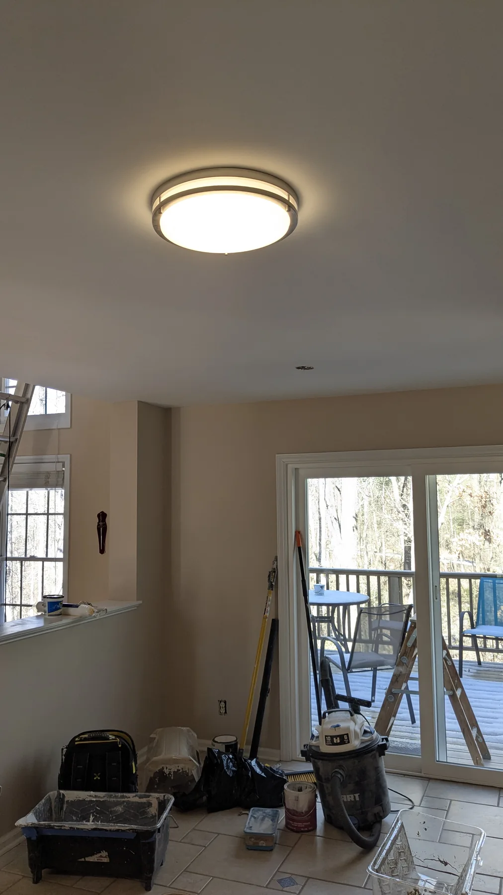 Smooth painted ceiling around a ceiling light