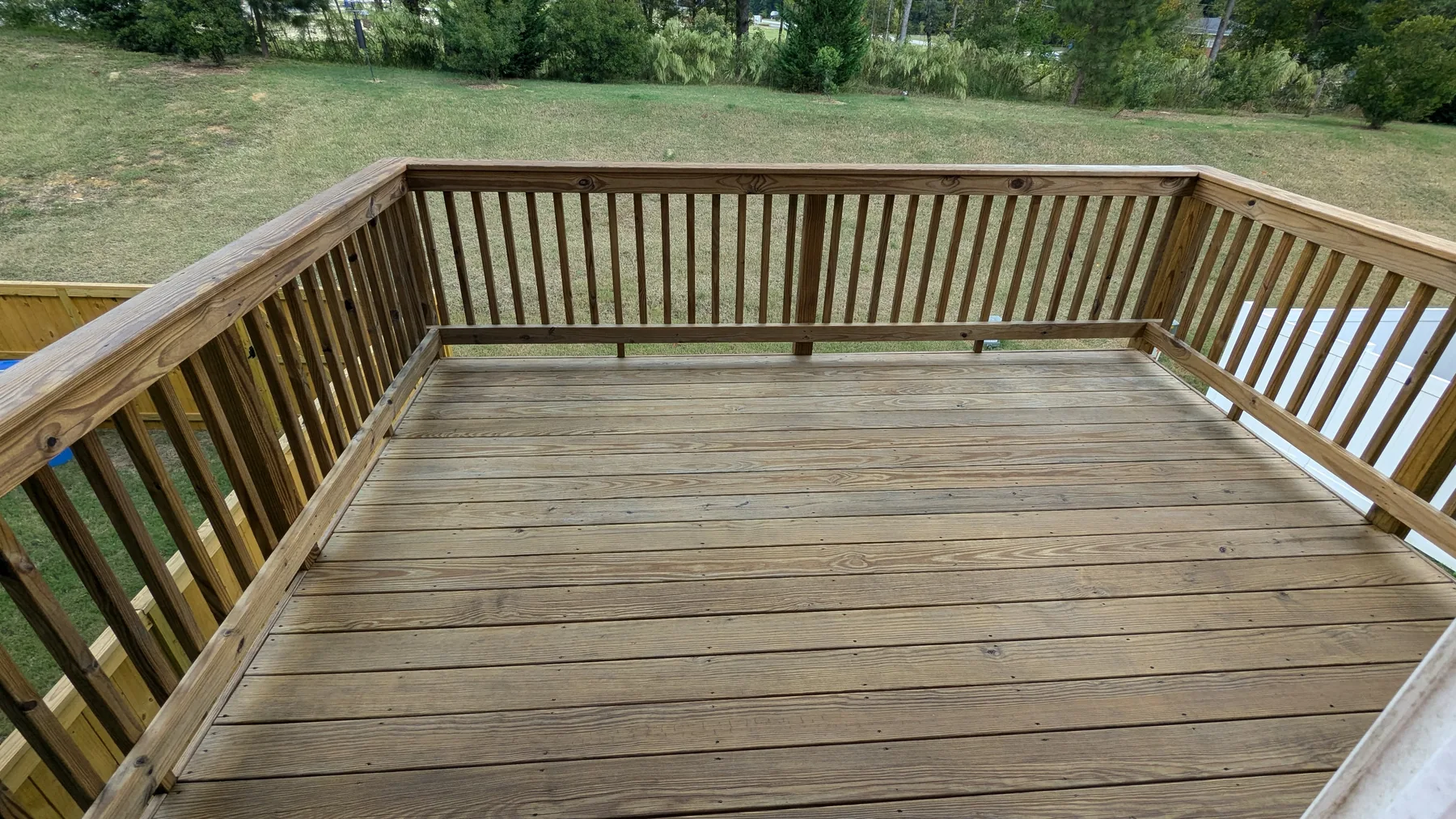 Weathered wood deck boards and railing