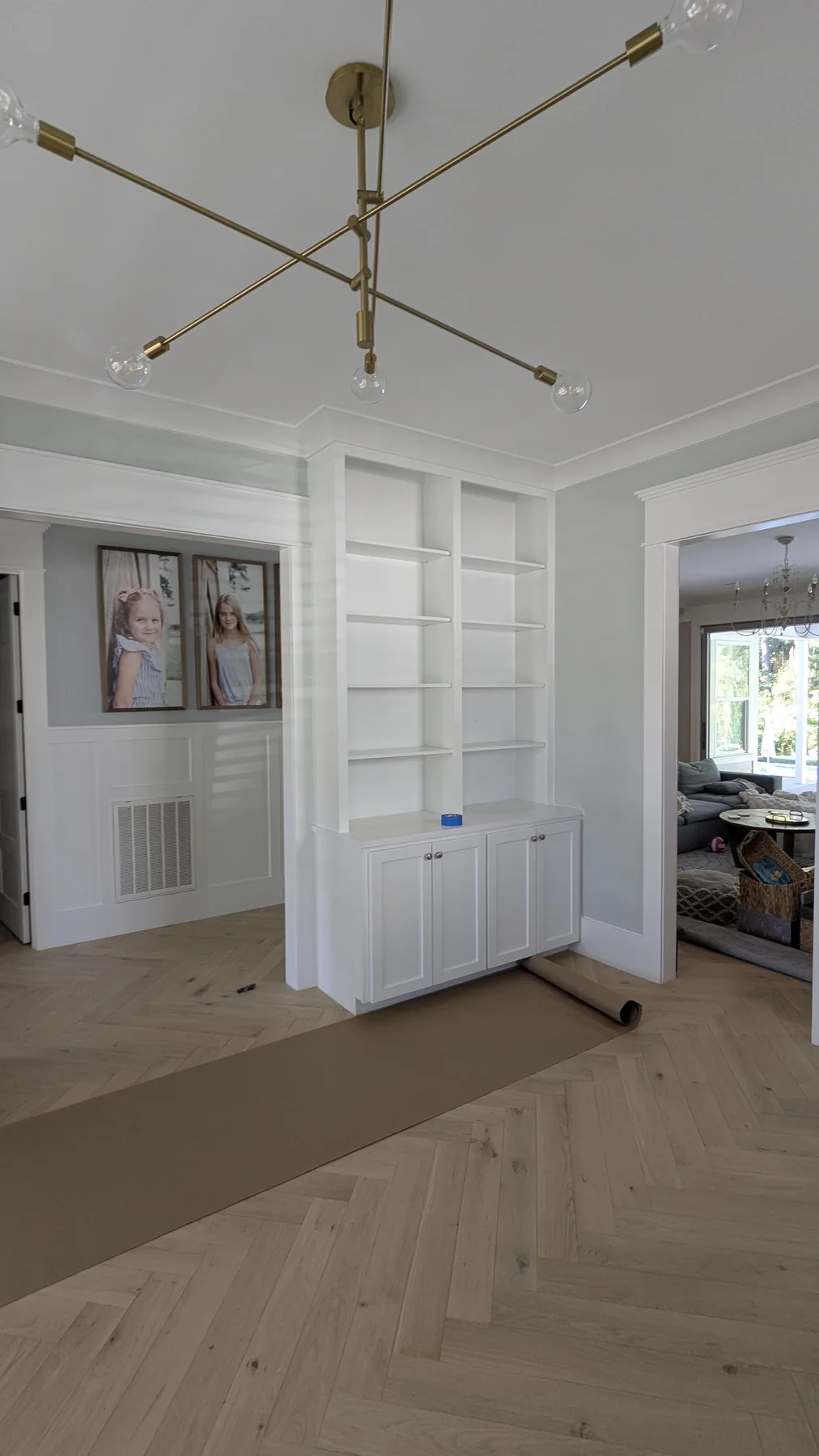 Light dining room with white decorative wall molding