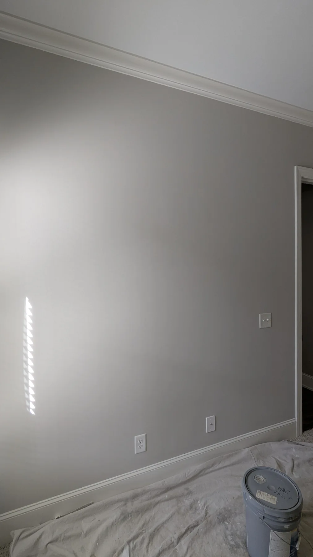 Smooth gray wall after repair and painting